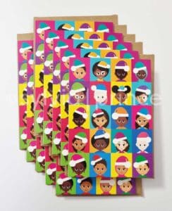 Cartoon style illustration of 20 happy, young children in various shades of black and brown, two living with albinism, six living with vitiligo. They all have different hairstyles and two of the girls are wearing hijabs. They are all wearing brightly coloured 'Santa' hats with white bobbles and trims, and tops in a variety of bright colours. The background is a patchwork of different colours.