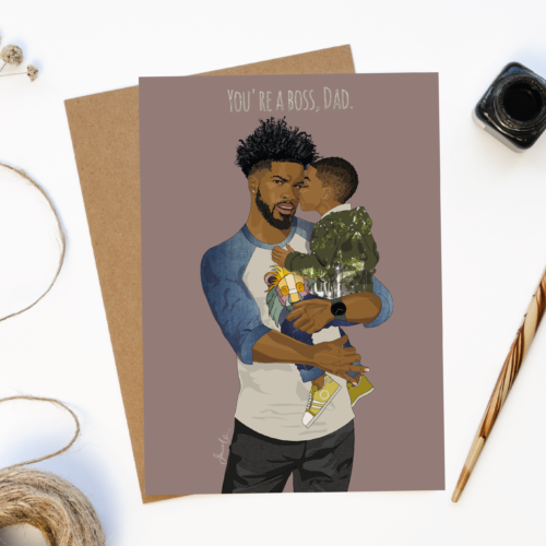 Greeting Card depicting black father holding young son in his arms with the caption, "You're a boss dad!"