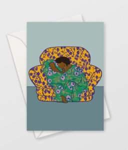 greeting card with envelope. "Cosy - Chillin' August" greeting card design is inspired by Frederic Leighton's famous painting, Flaming June. A brown skinned woman in a green dress sleeps in a yellow armchair. the images represents, rest, comfort, safety, time out from our hectic lives, and work-life balance.