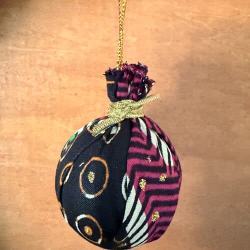 African fabric bauble with gold hanging thread.