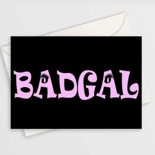 greeting card has bold pink "badgal" text with eye lashes on the A's, on black background. shown with a plain envelope.